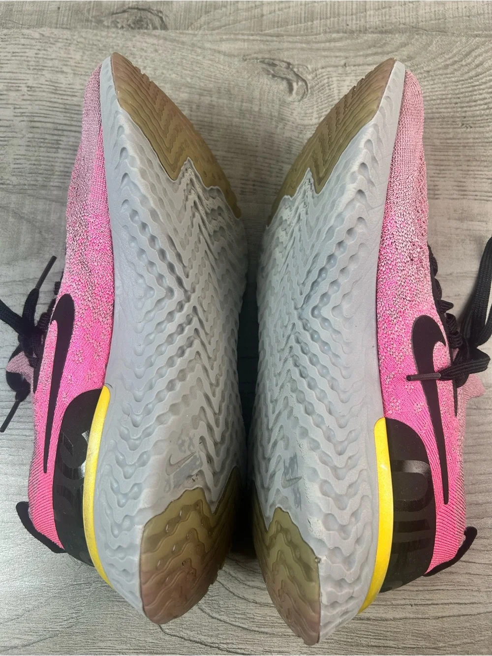 Nike women’s Epic React Flyknit 10.5Pink Black Running Sneakers with Yellow Heel